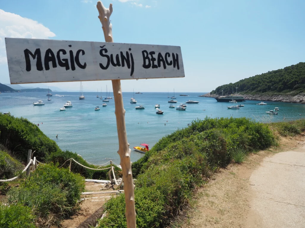 A sign at Šunj beach