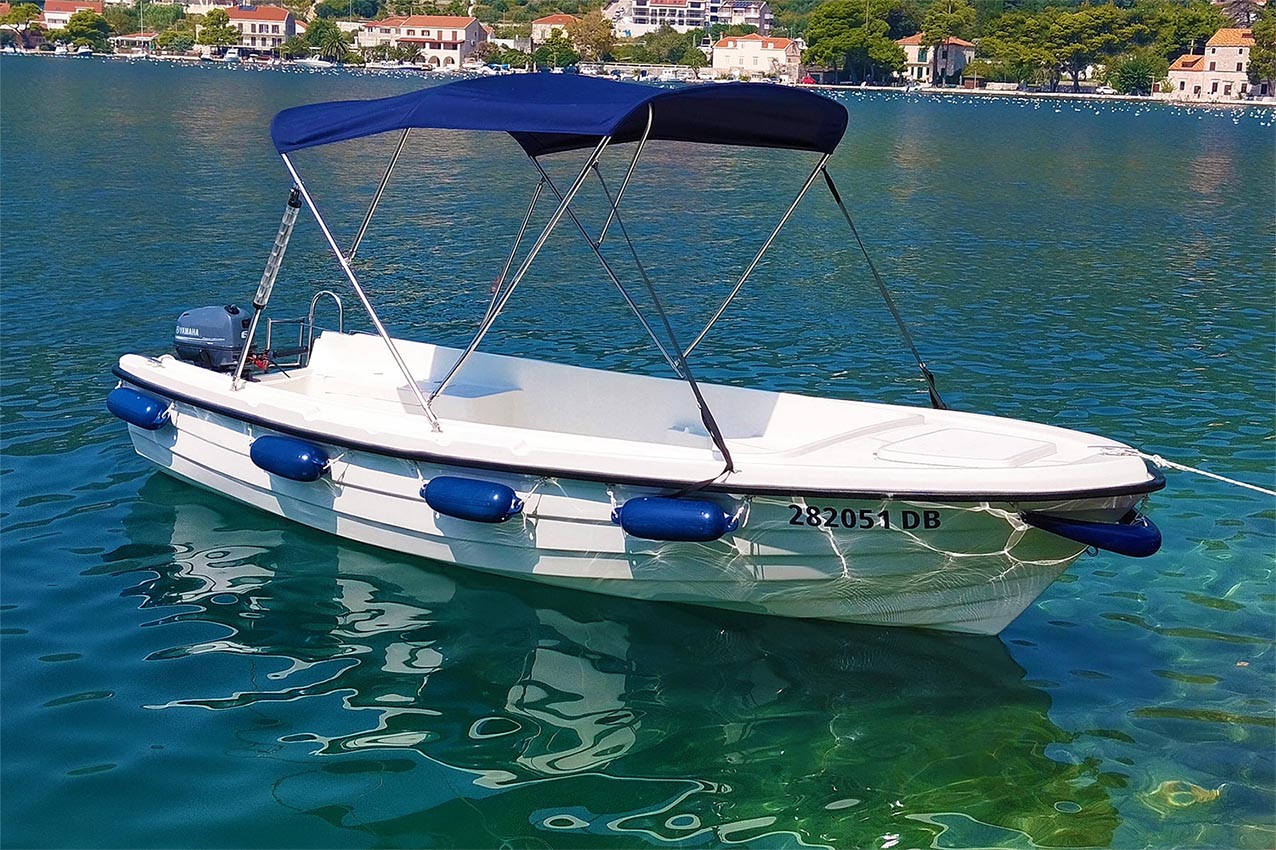 A small boat for rent with people inside